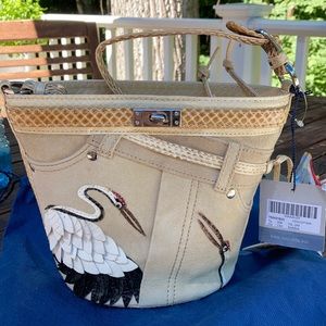 Tosca Blu small tan purse with decorative birds.